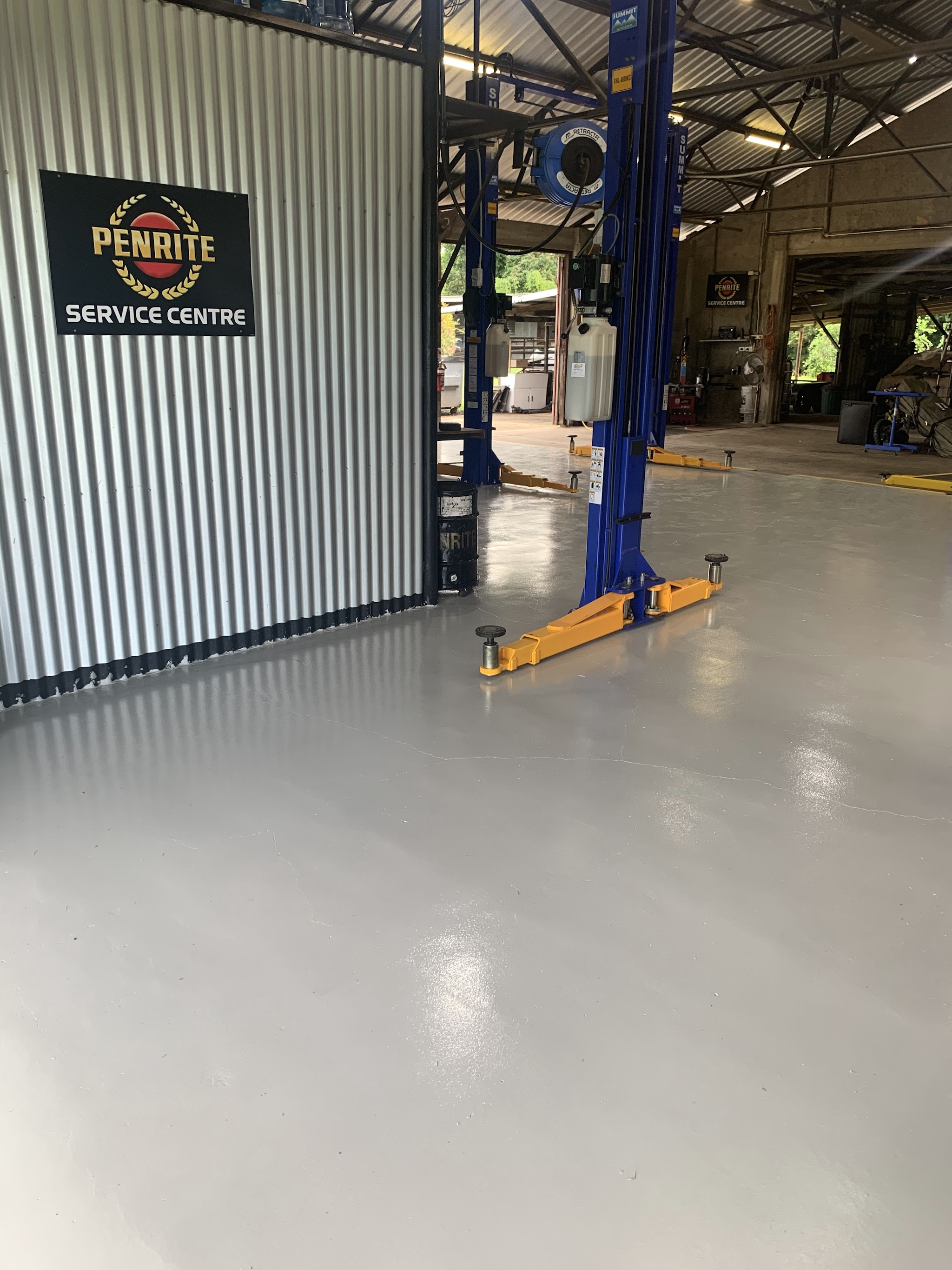 Inside the Torque Auto Babinda workshop, showing the resurfaced floor and one of the two post hoists
